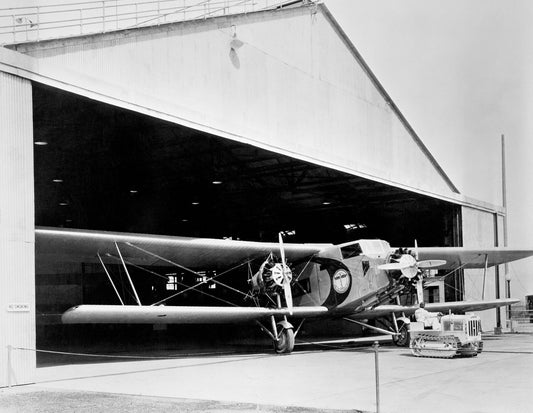 Model 80 Emerging from Aircraft Hangar BI211860