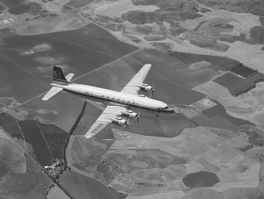 DC-7 in Flight Above Farmland BI2306