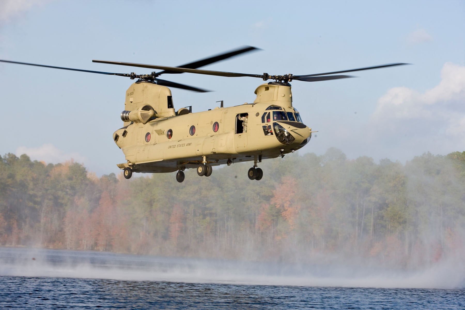 CH-47F Chinook Flies Over River BI232546